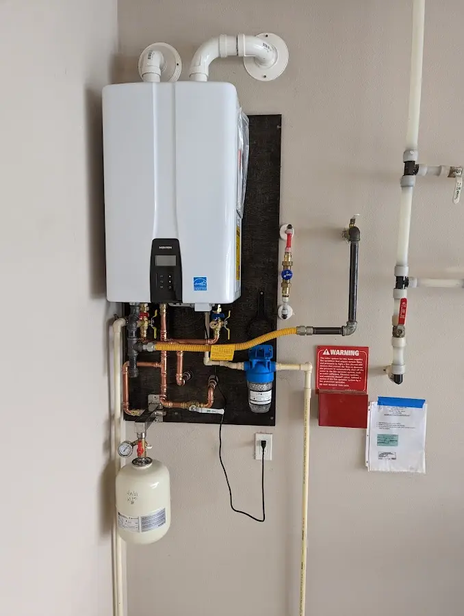 Professional plumber installing copper piping in a Los Altos home